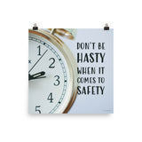 A workplace safety poster showing a close-up of a clock face with the slogan don't be hasty when it comes to safety.