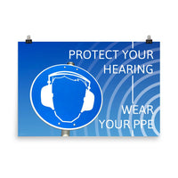 A hearing protection poster showing a bright blue construction sign with an illustration of a face wearing ear muffs with sound waves coming from the right and a safety slogan in the upper right and bottom right corners.
