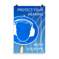 A hearing protection poster showing a bright blue construction sign with an illustration of a face wearing ear muffs with sound waves coming from the right and a safety slogan in the upper right and bottom right corners.