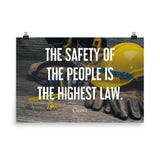 A safety poster showing a close-up of various PPE including safety glasses, ear muffs, gloves, a hard hat, and work boots with the quote by Cicero in the foreground.