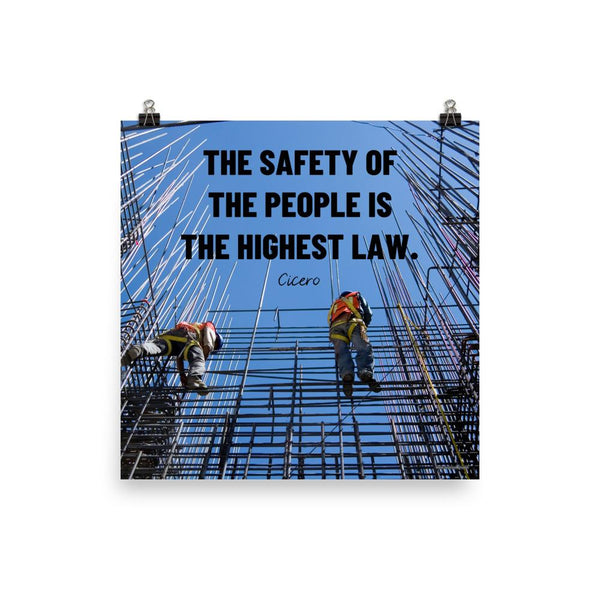 A safety poster showing construction workers scaling rebar with a bright blue sky as the background and a safety quote in black block text.