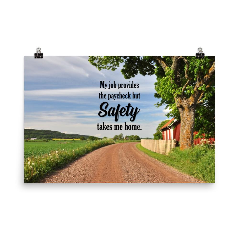 A workplace safety poster showing a beautiful sunny day in the countryside with a red barn on the right of a dirt road and text above the road saying my job provides the paycheck but safety takes me home.