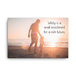 A workplace safety poster showing a father and his young daughter walking on the shore of a beach with a beautiful sunset in the background and text saying safety is a small investment for a rich future.