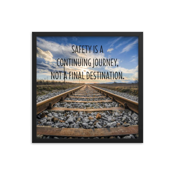 A workplace safety poster depicting old railroad tracks leading into a cloudy horizon with the text safety is a continuing journey, not a final destination.