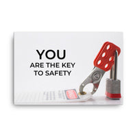A workplace safety poster showing a lockout tagout lock and tag with the text you are the key to safety.