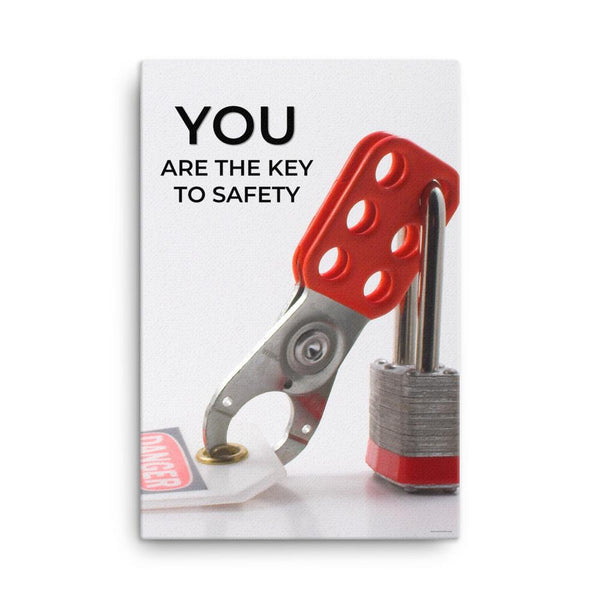 A workplace safety poster showing a lockout tagout lock and tag with the text you are the key to safety.