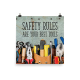A safety poster showing various tools including screwdrivers, pliers, and wrenches laying on a worktable with the slogan safety rules are your best tools.