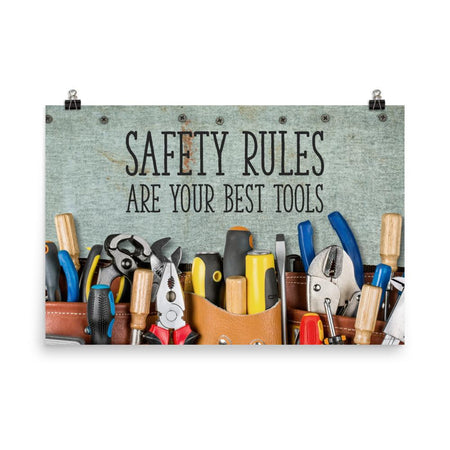 A safety poster showing various tools including screwdrivers, pliers, and wrenches laying on a worktable with the slogan safety rules are your best tools.