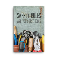 A safety poster showing various tools including screwdrivers, pliers, and wrenches laying on a worktable with the slogan safety rules are your best tools.