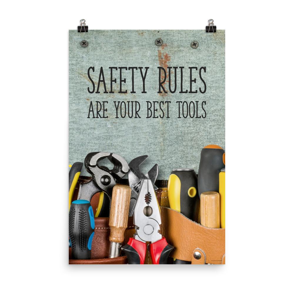 A safety poster showing various tools including screwdrivers, pliers, and wrenches laying on a worktable with the slogan safety rules are your best tools.
