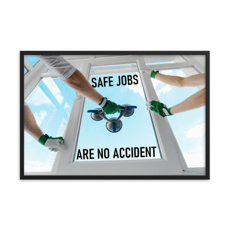A workplace safety poster showing a close-up of two worker's hands wearing gloves while installing windows with the slogan safe jobs are no accident.