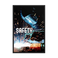 A safety poster showing a close-up of a welder welding a pipe while wearing a welding hood with bright sparks flying all around with the slogan safety first.