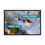 A safety poster showing a bird's-eye view of a worker in a warehouse pulling boxes on a pallet jack with the slogan work smart, work safe.