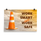 A safety poster showing a close-up of an orange traffic cone with the slogan work smart and work safe.