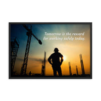 A safety poster showing a worker on a construction site being silhouetted by a sunset of orange and blue colors with the slogan tomorrow is the reward for working safely today.