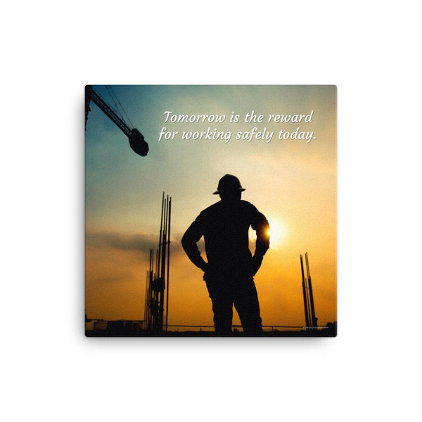 A safety poster showing a worker on a construction site being silhouetted by a sunset of orange and blue colors with the slogan tomorrow is the reward for working safely today.