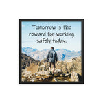 A workplace safety poster showing a man standing on a peak of a mountain with a bright blue sky and mountains behind him with the slogan tomorrow is the reward for working safely today.