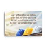 A workplace safety poster showing 3 multi colored hardhats sitting on a wall with the slogan safety isn't something you postpone for the ideal and comfortable future. It's the first condition necessary for the messy and unpredictable present.