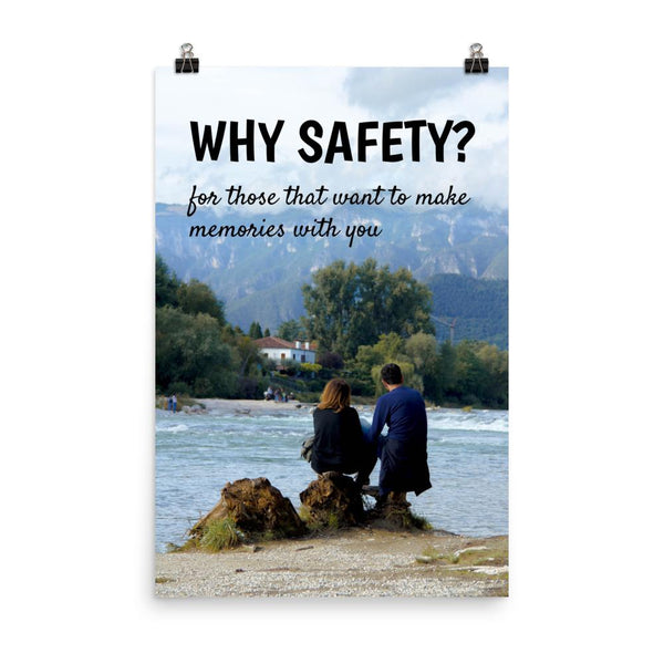 A workplace safety poster showing a couple sitting on some rocks overlooking a river with a mountainous landscape in the background with the slogan why safety? for those that want to make memories with you.