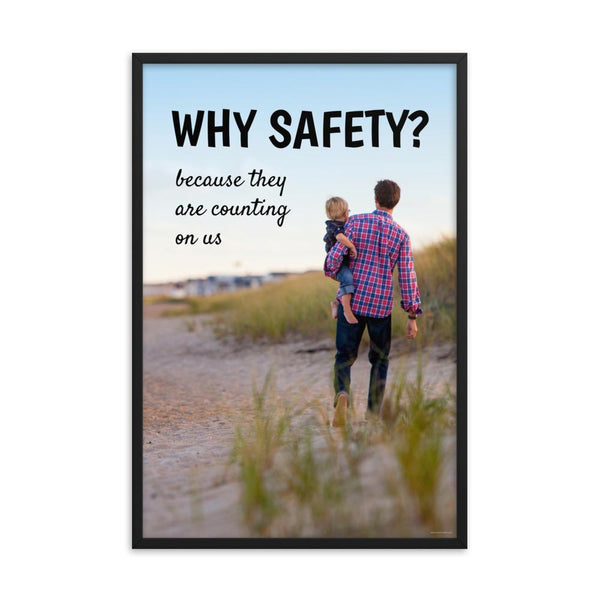 A workplace safety poster showing a man carrying his young child along the beach on a beautiful sunny day with the slogan why safety? because they are counting on us.