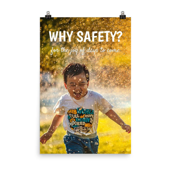 A workplace safety poster showing a young child running through a sprinkler with a huge smile on his face with the slogan why safety? for the joy of days to come.