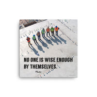 A workplace safety poster showing an aerial view of construction workers in reflective vests standing in a line on top of a building with their shadows being cast on the building with the quote no one is wise enough by themselves by Plautus.