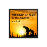 A workplace safety poster showing a construction site and construction workers being silhouetted by a bright and beautiful sunset of different shades of orange with the slogan working safely may get old, but so do those who practice it.