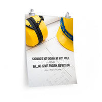 A safety poster showing a yellow hard hat and yellow ear muffs on blueprints with a safety quote by Johann Wolfgang von Goethe that says "Knowing is not enough, we must apply. Willing is not enough, we must do."