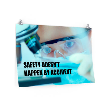 Safety poster of a close up of a woman's eyes wearing safety glasses inspecting a sample on a microscope with safety slogan written at the bottom.