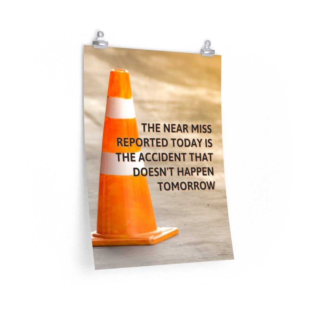 A workplace safety poster showing an orange safety cone with the slogan the near miss reported today is the accident that doesn't happen tomorrow.