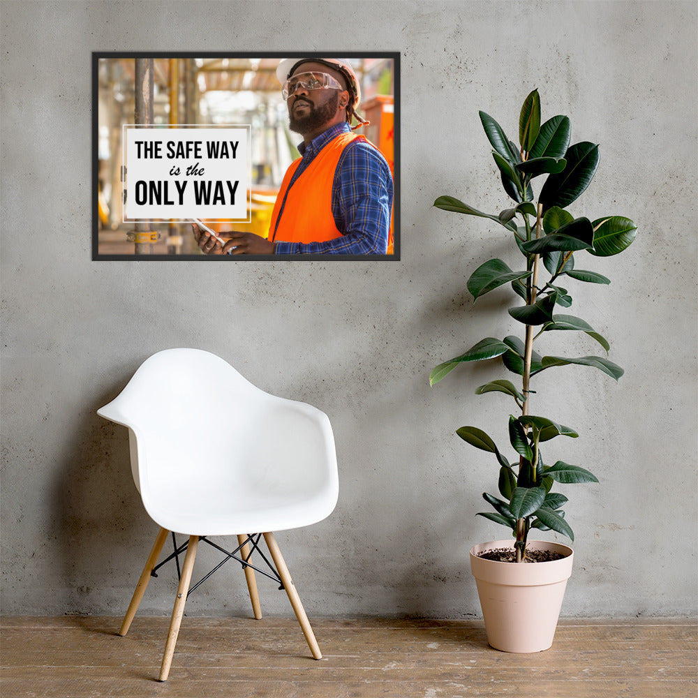 A construction worker in an orange vest, hard hat, and safety glasses working intently with the slogan "The safe way is the only way."