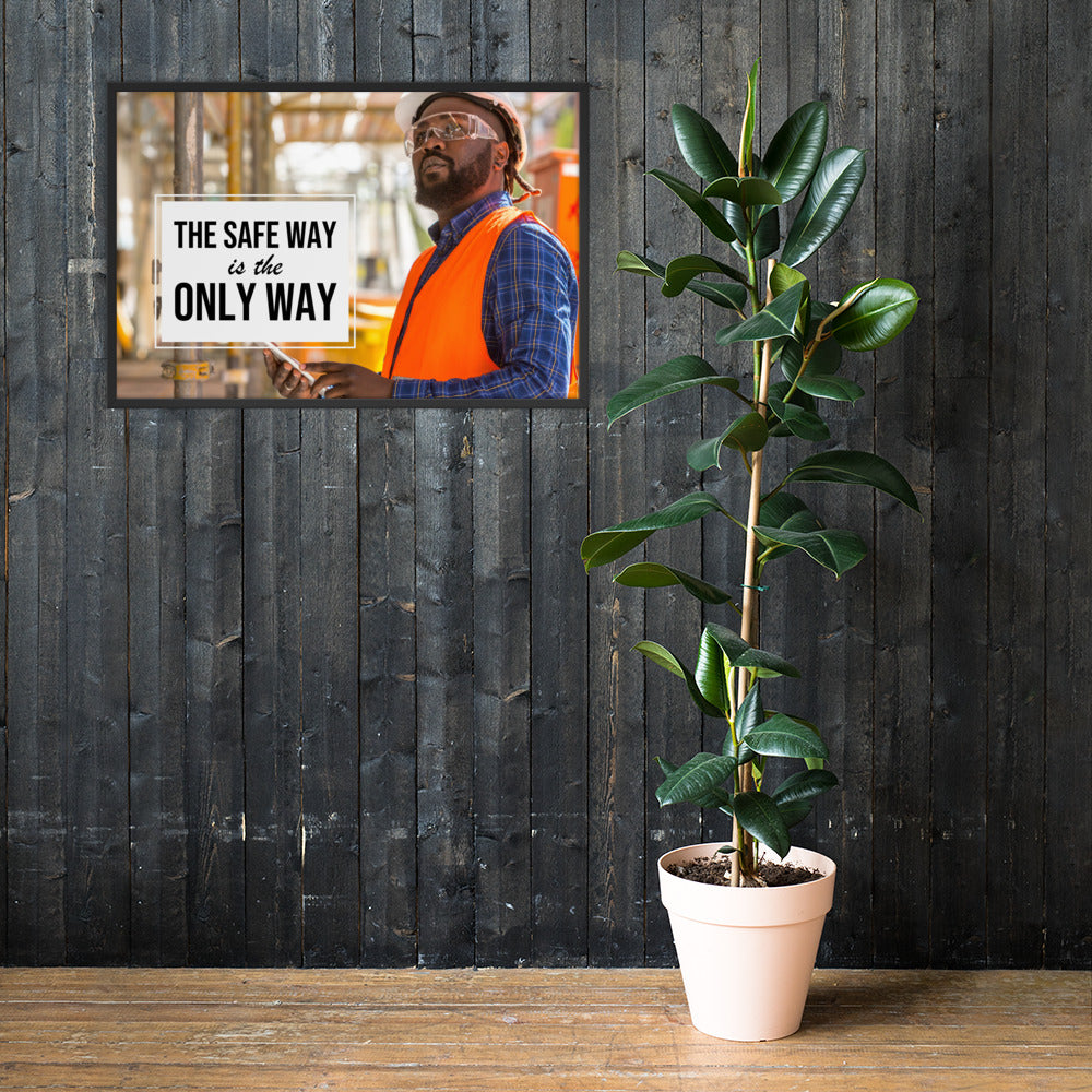 A construction worker in an orange vest, hard hat, and safety glasses working intently with the slogan "The safe way is the only way."