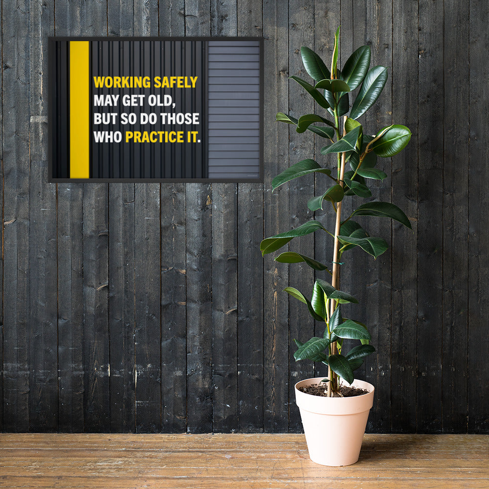 A construction safety poster showing a black metal wall with a yellow stripe with the slogan "Working safely may get old, but so do those who practice it."