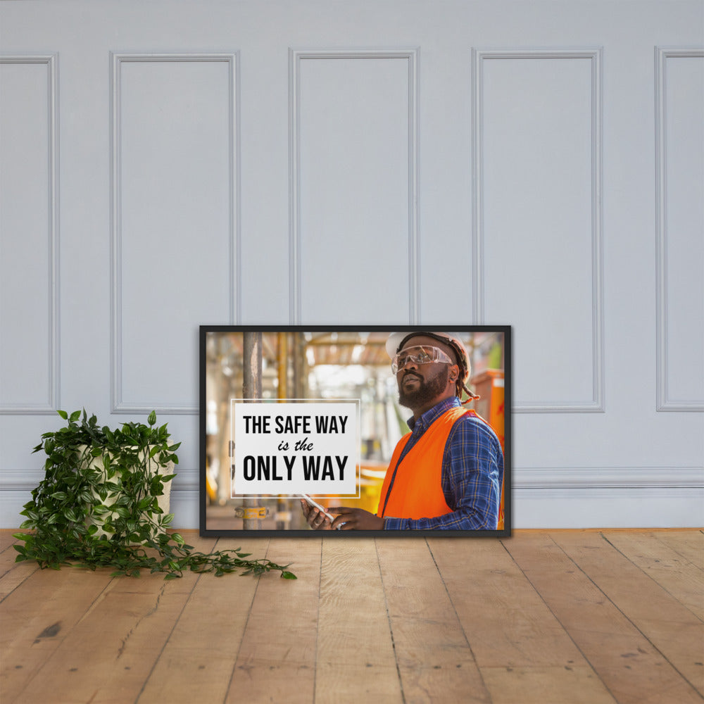 A construction worker in an orange vest, hard hat, and safety glasses working intently with the slogan "The safe way is the only way."