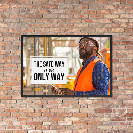 A construction worker in an orange vest, hard hat, and safety glasses working intently with the slogan "The safe way is the only way."