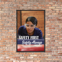 A safety poster showing a woman in safety glasses working in a woodshop with the slogan "Safety first, safety always" below her.