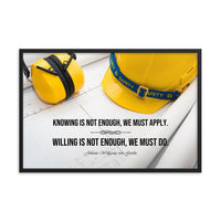 A safety poster showing a yellow hard hat and yellow ear muffs on blueprints with a safety quote by Johann Wolfgang von Goethe that says "Knowing is not enough, we must apply. Willing is not enough, we must do."