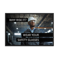 An eye safety poster showing a man in a white hard hat and safety glasses in a warehouse with the slogan "Why risk it? Wear your safety glasses."