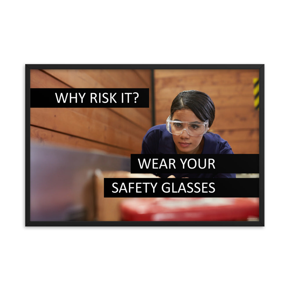 A safety poster showing a woman using a table saw to cut wood wearing safety glasses with the slogan "Why Risk It? Wear Your Safety Glasses."