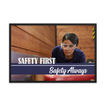 A safety poster showing a woman in safety glasses working in a woodshop with the slogan "Safety first, safety always" below her.