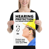 An ear safety poster showing a close up of a woman's profile wearing a yellow hard hat, ear plugs and safety glasses with a safety slogan and infographics of hearing PPE all around her.