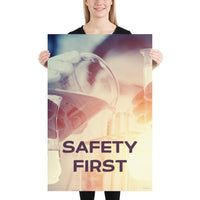 A safety poster showing a close-up of multiple gloved hands in a laboratory pouring substances into a beaker with the slogan safety first in the foreground.