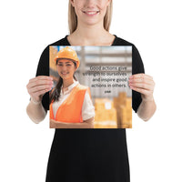 Safety poster showing a female warehouse worker smiling and wearing an orange reflective safety vest and orange hard hat with a safety quote written in dark text.