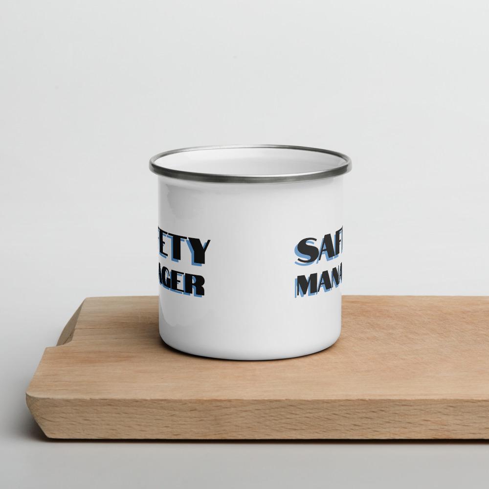 White metal mug with a silver rim with "Safety Manager" in bold text with a blue drop shadow across the side.