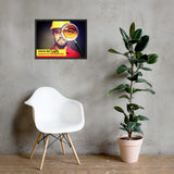 An eye safety poster showing a close up of a man's face wearing safety glasses and a yellow hard hat with a magnifying glass focusing on the right eye with an eye safety slogan underneath him.