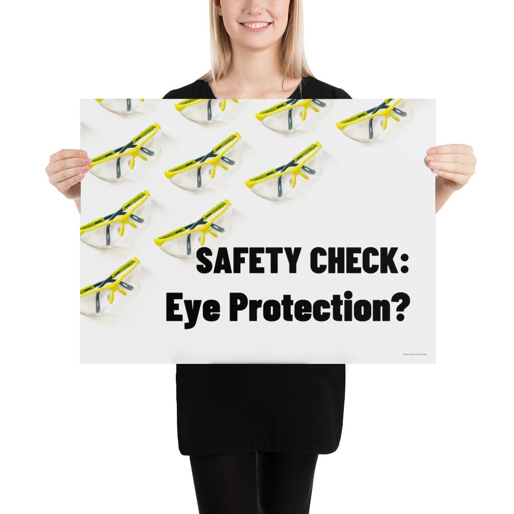 An eye safety poster depicting many clear safety glasses with yellow trim neatly lined up in rows and rows with a safety slogan in the foreground.
