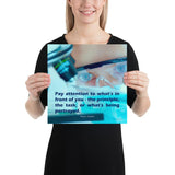 Workplace safety poster of a close up of a woman's eyes wearing safety glasses inspecting a sample on a microscope with safety quote written at the bottom.