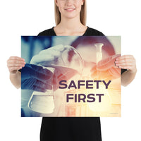 A safety poster showing a close-up of multiple gloved hands in a laboratory pouring substances into a beaker with the slogan safety first in the foreground.