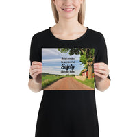 A workplace safety poster showing a beautiful sunny day in the countryside with a red barn on the right of a dirt road and text above the road saying my job provides the paycheck but safety takes me home.