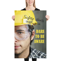 Safety poster showing a close up on half of a man's face wearing a yellow hard hat and safety glasses with text to the right.